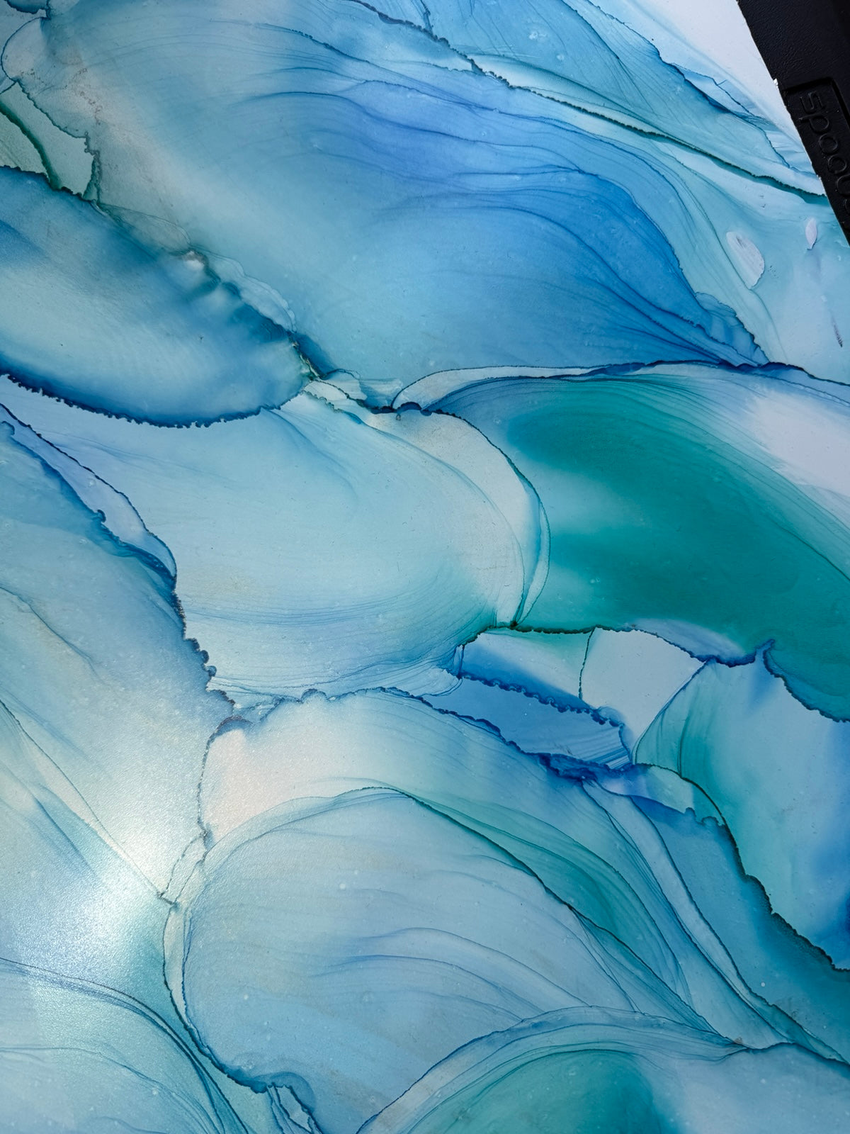 Abstract blue and white painting with wavy patterns